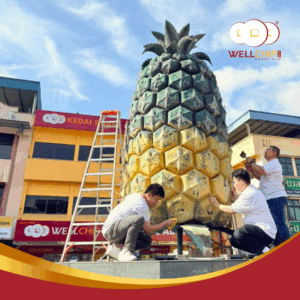 Well Chip Group CSR activity at Kedai Pajak Well Chip Pekan Nanas, sponsoring repainting works for the pineapple landmark.